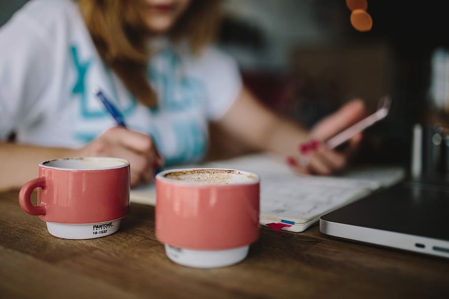 Young woman working in a cafe, caucasian, female, office, workspace