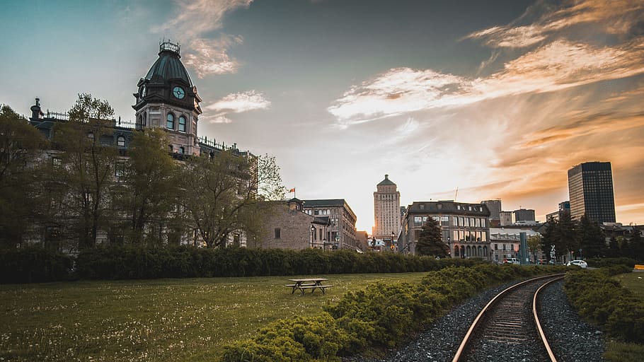 train rail near concrete houses during daytime, photo of city with train tracks HD wallpaper
