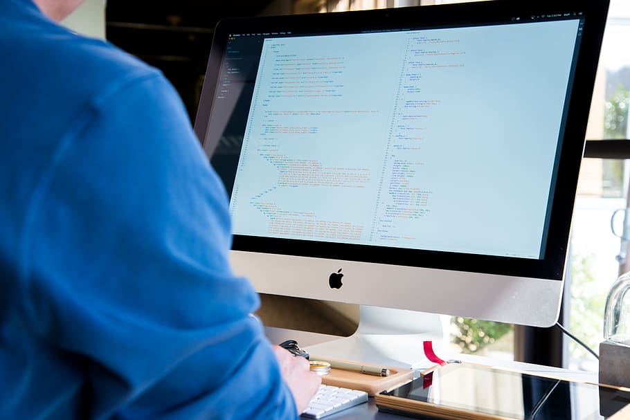 person wearing blue shirt in front of silver iMac, screen, technology HD wallpaper