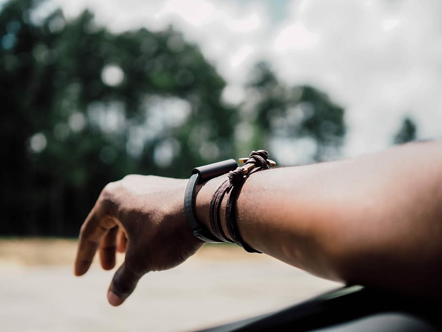 selective focus photography of person's arm with three leather bracelets, person wearing brown leather bracelet, HD wallpaper