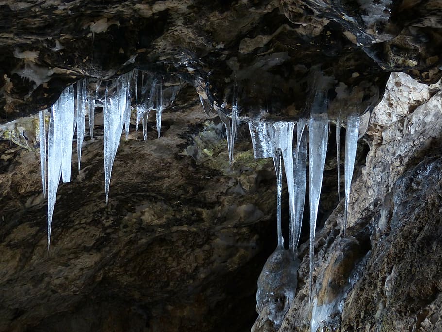 low-angle photo of stone cave with icicles on entrance, ice HD wallpaper