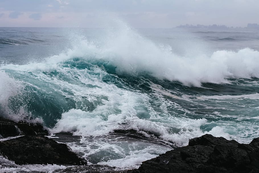 ocean waves hitting rock in beach, sea waves at shore, coast