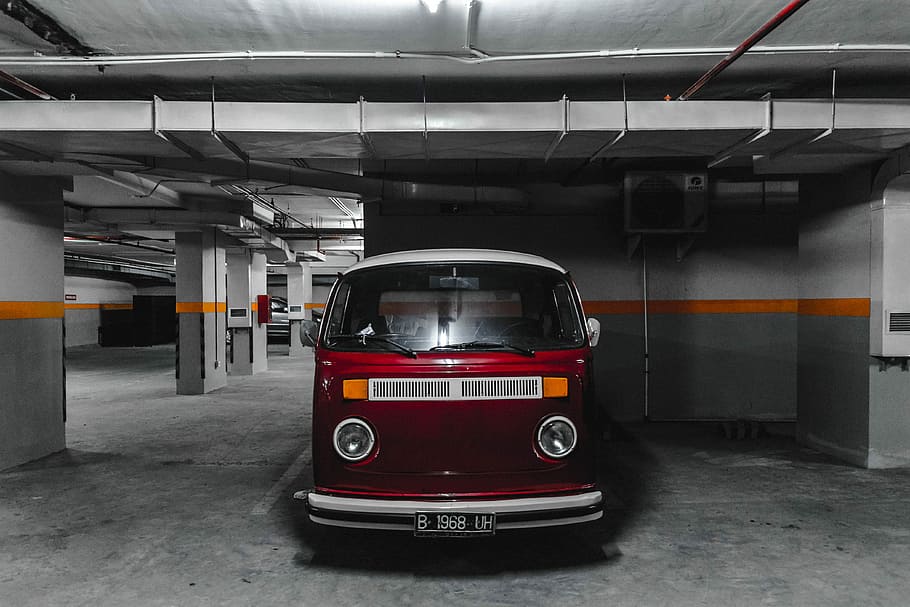 white and red car parking on parking lot, red and white Volkswagen T2 van in parking area