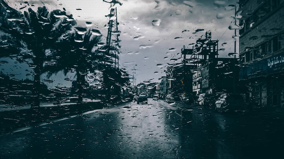 grayscale photo of buildings under cloudy skies, photography of wet glass with a scene of road HD wallpaper