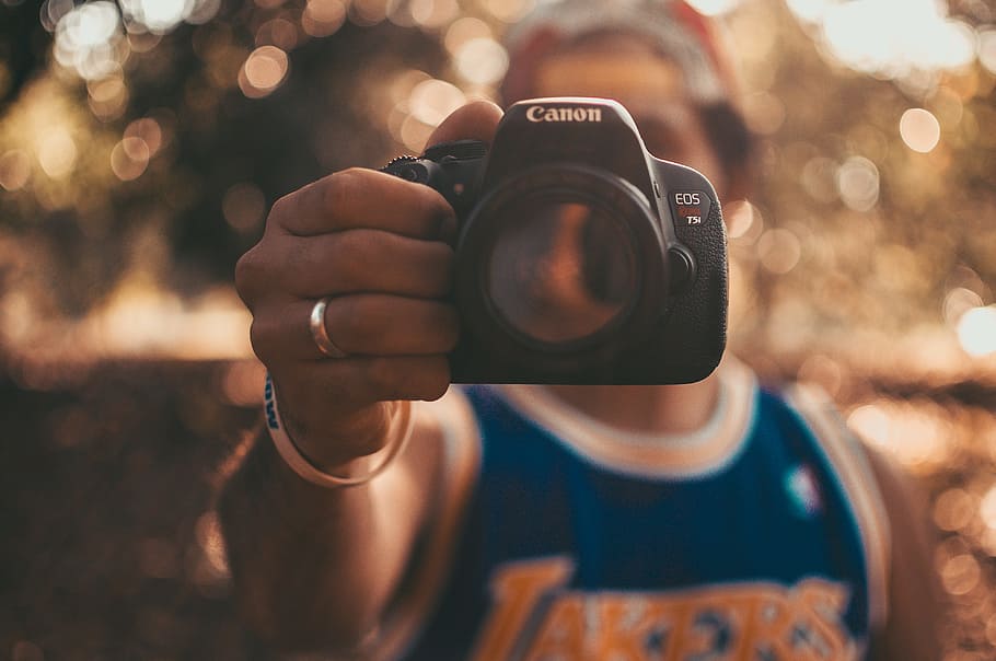 Canon DSLR Camera, hand, holding, lens, macro, outdoors, photography themes HD wallpaper