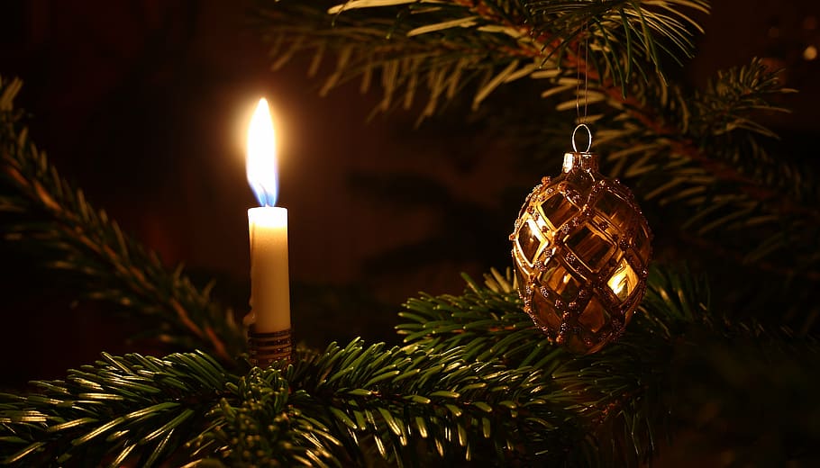lighted taper candle beside Christmas ornament hanging on fir tree, HD wallpaper