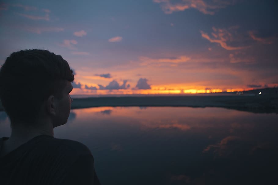 person standing near sea under cloudy sky, man looking on beach HD wallpaper
