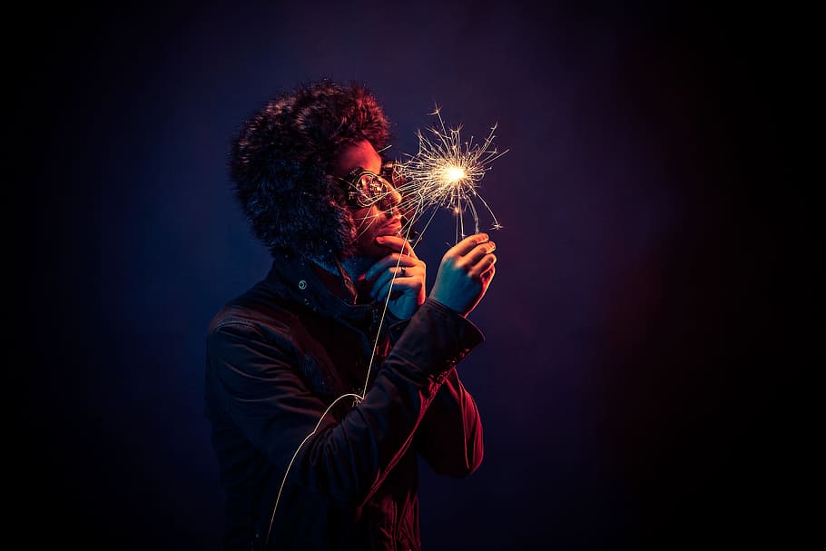 man in black jacket holding spark, man holds sparkler, person, HD wallpaper