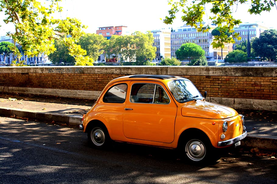 orange Volkswagen beetle car parked beside wall, fiat500, oldtimer HD wallpaper