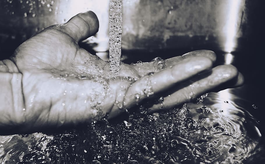 grayscale photography of pouring water on hand, close-up, human hand HD wallpaper