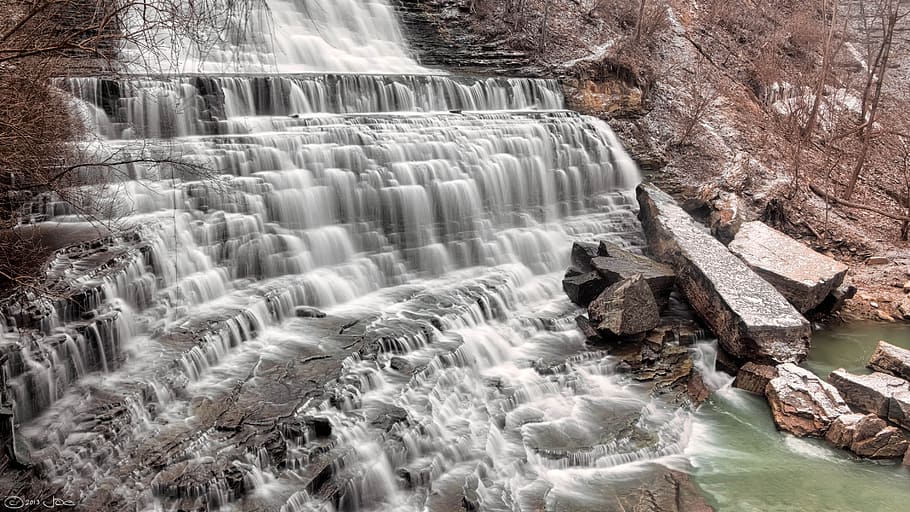 Waterfalls Flowing on Brown Rock Formation Towards River, boulder HD wallpaper