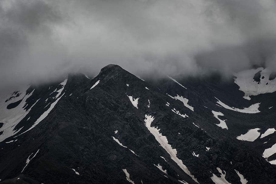 aerial photo of mountain, black mountain with snow, cloud, overcast HD wallpaper