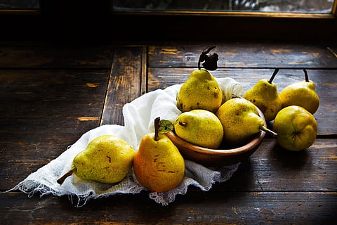 photography of pear fruits in bowl, pears, table, wood, window HD wallpaper