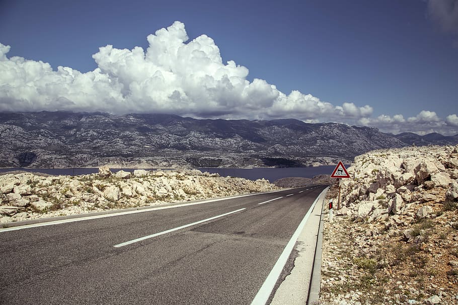 aerial view of asphalt road under cloudy sky, blue, brown, clouds HD wallpaper