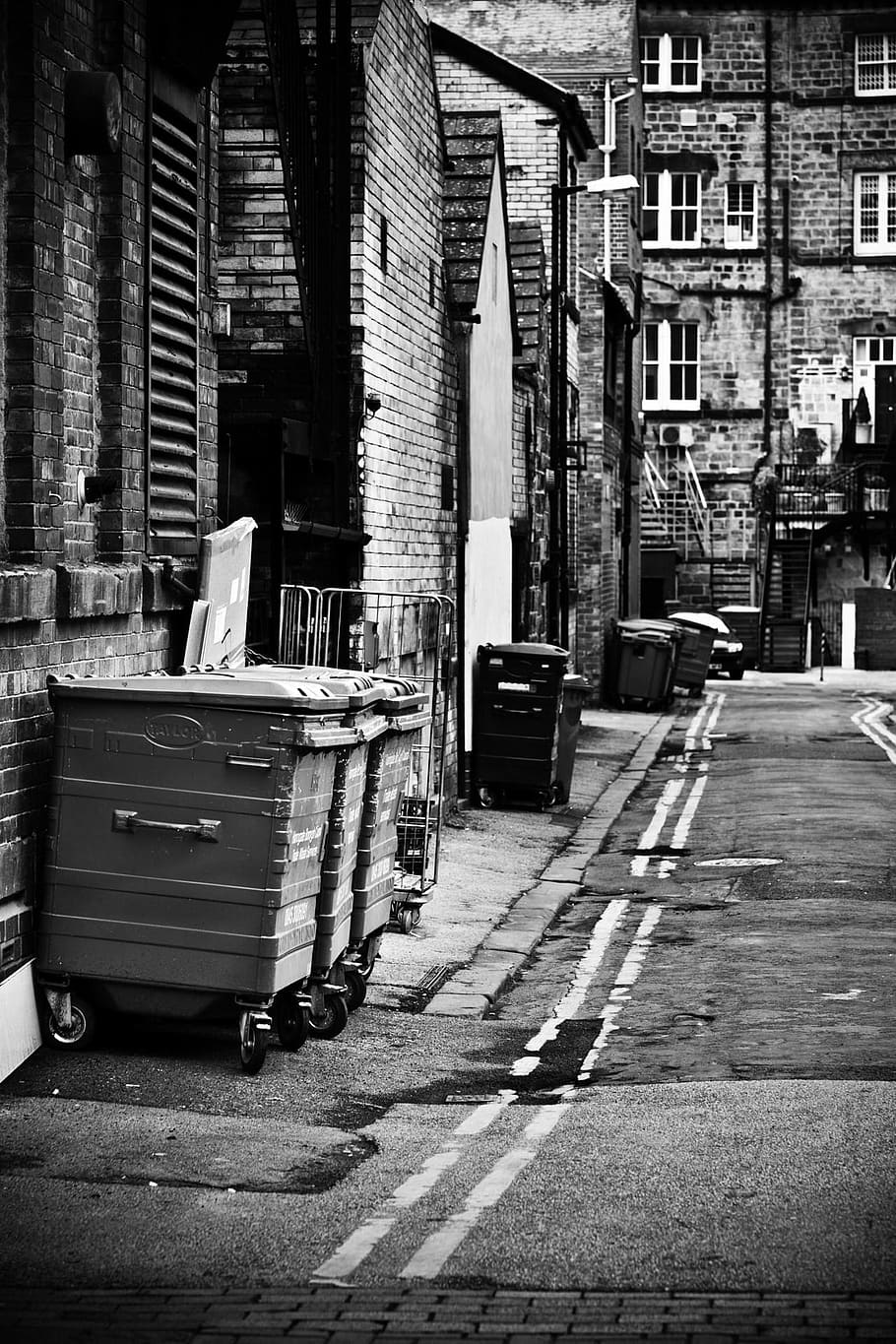 Hd Wallpaper Grayscale Photo Of Garbage Bin Behind Buildings Alleyway City Wallpaper Flare