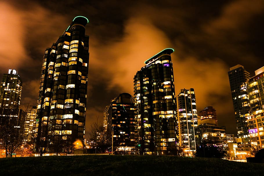 lightened high rise building at nighttime, clouds, skyline HD wallpaper