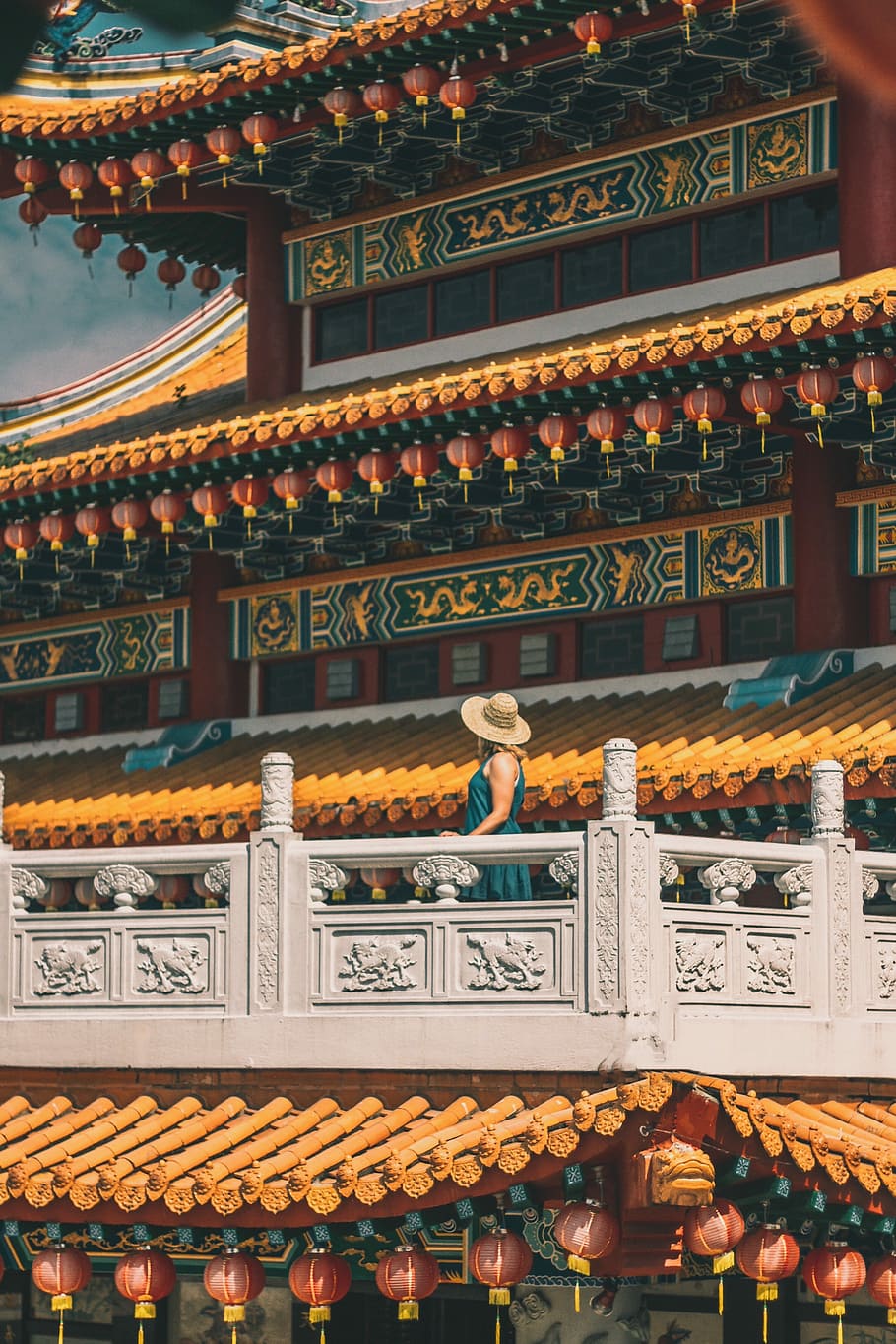 woman standing on gray patio of pagoda during daytime, woman in orange and green pagoda HD wallpaper