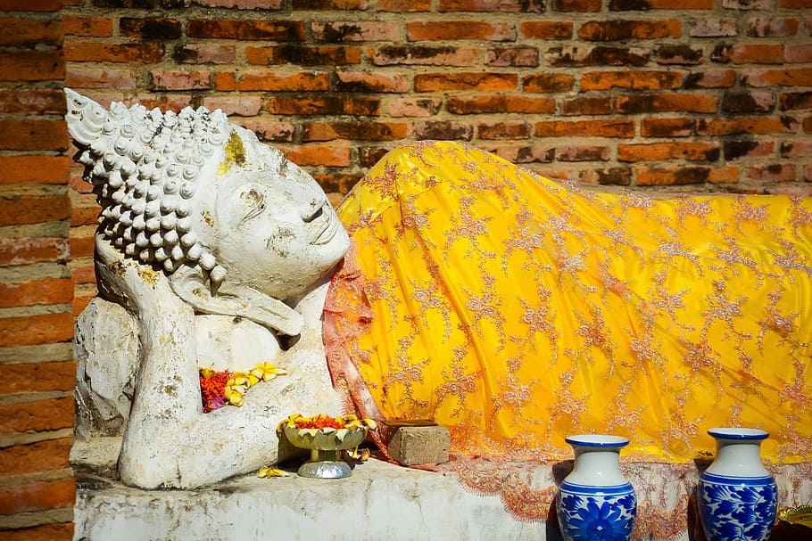 two white-and-blue delft vases near Gautama buddha statue, Thailand