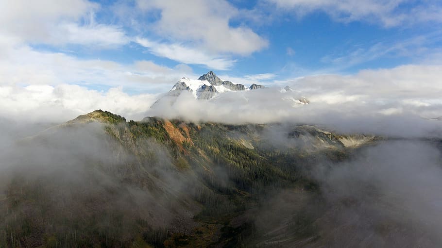 foggy mountain during daytime, landscape photography of cloudy mountain during daytime HD wallpaper