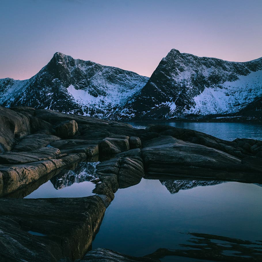 landscape photography of mountain beside body of water, ice covered rock mountain near water HD wallpaper