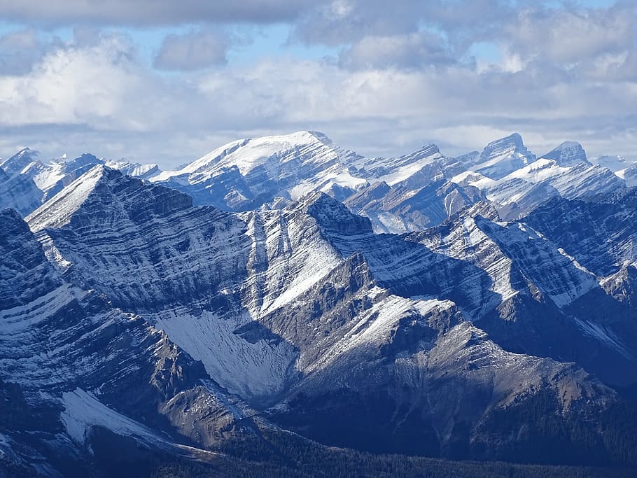 snow capped mountain range under the cloudy skies, rockies HD wallpaper