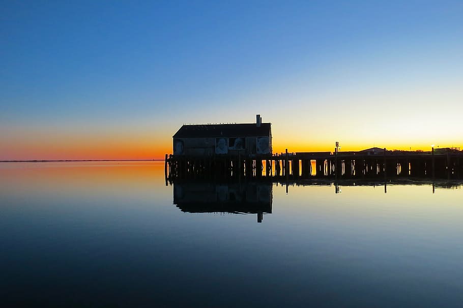 brown wooden house in the middle of body of water, provincetown HD wallpaper