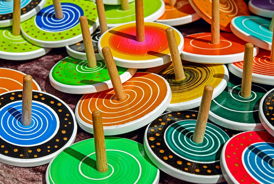 assorted-color-and-pattern wooden racks, roundabout, toys, colorful