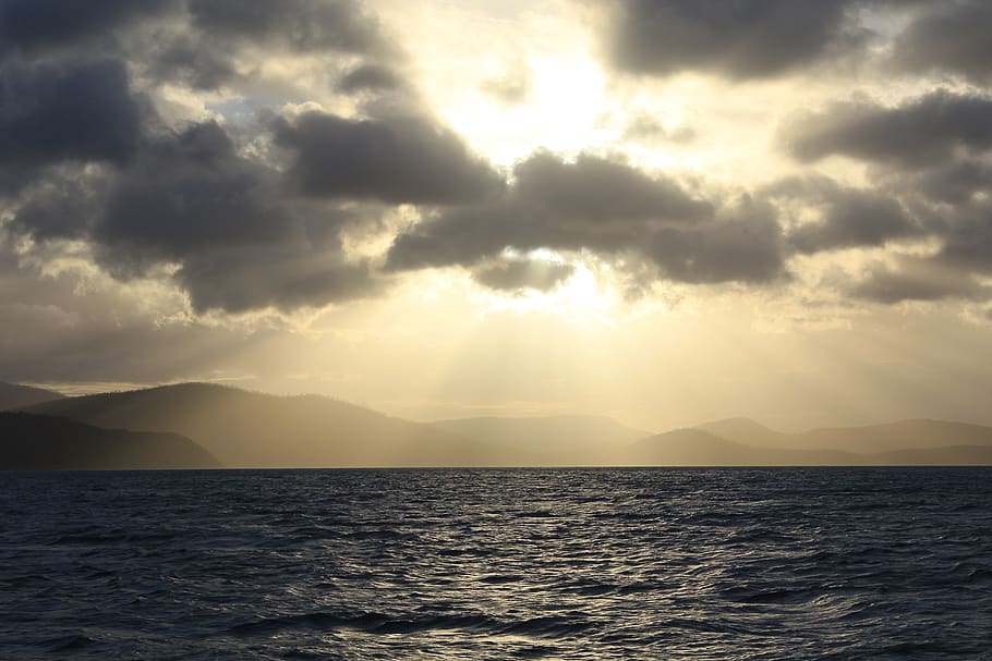 sea, ocean, storm, sun ray, clouds, weather, water, sky, scenic HD wallpaper