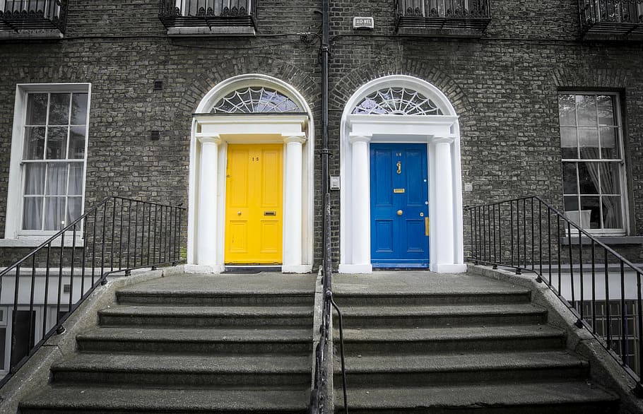 two yellow and blue doors closed at daytime, dublin, ireland city