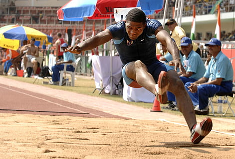 man in black shirt jumping on sand, Athlete, Long Jump, Competition HD wallpaper