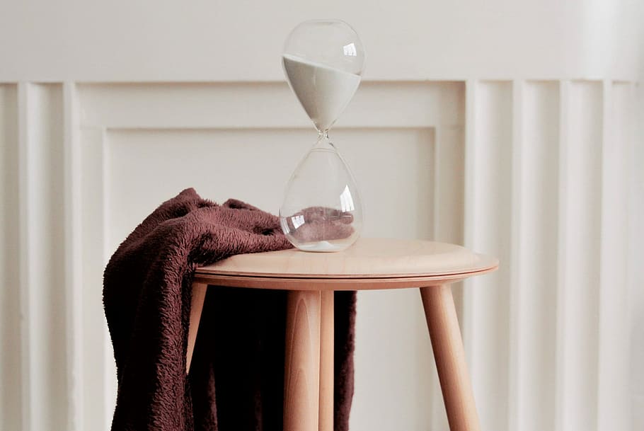 clear hourglass on beige wooden stool, table, modern, minimalist HD wallpaper