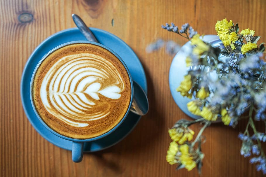 flat lay photography of coffee near flowers, blue ceramic cup filled with coffee HD wallpaper