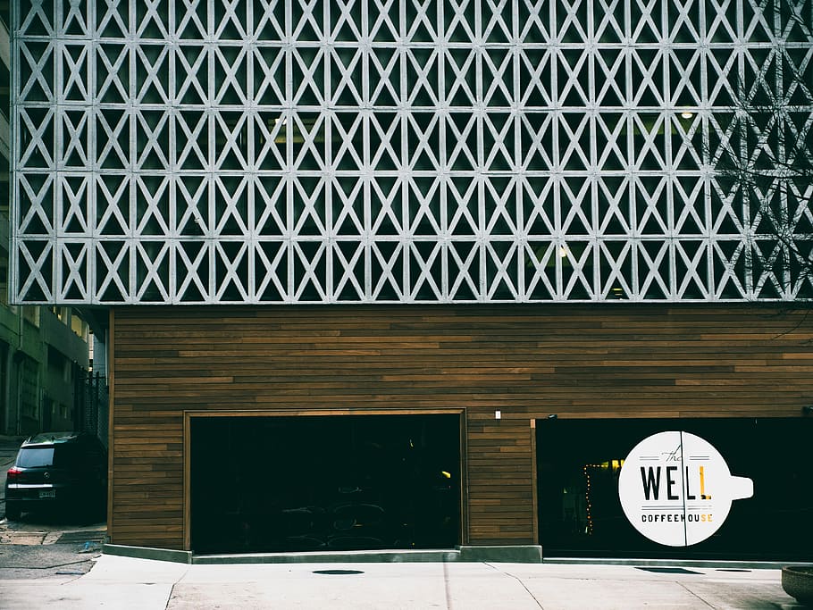 black vehicle parked beside Well storefront, white and black Well signage on glass door HD wallpaper