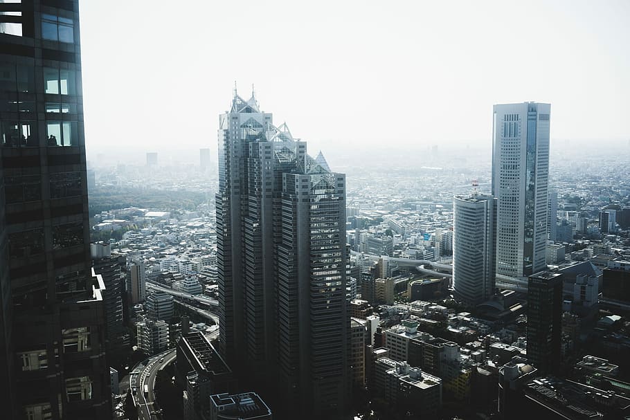 photo of concrete buildings under cloudy sky, aerial view of cityscape HD wallpaper
