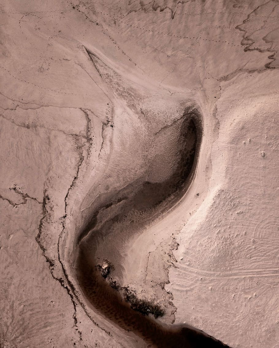 photo of beige crevice, aerial photo of land formation during daytime HD wallpaper