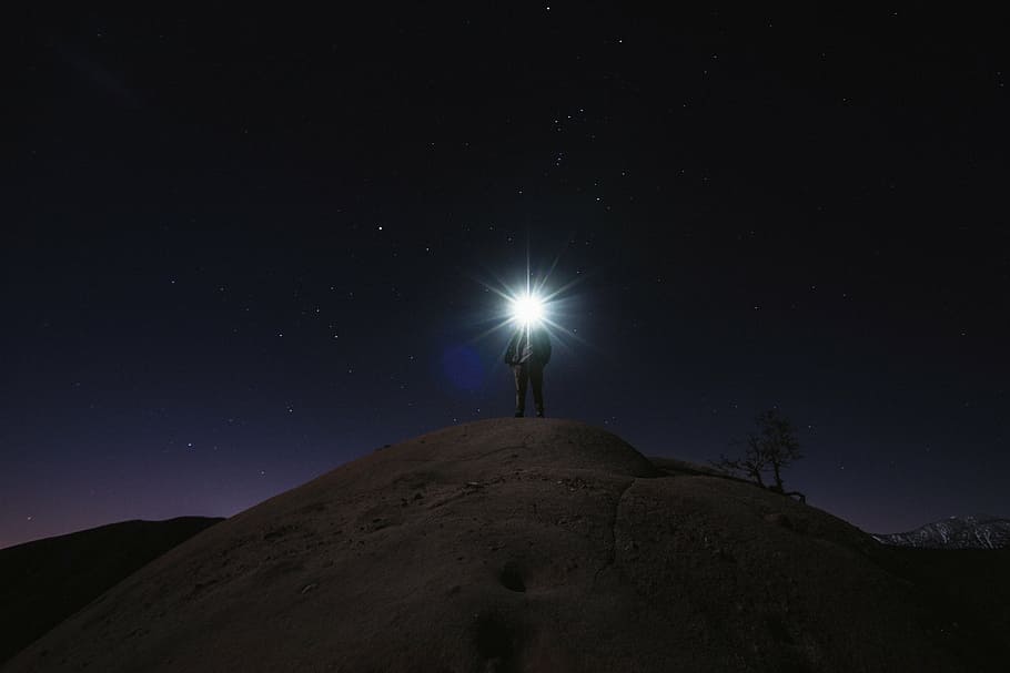 HD wallpaper: person on hill with white bright light at night time ...