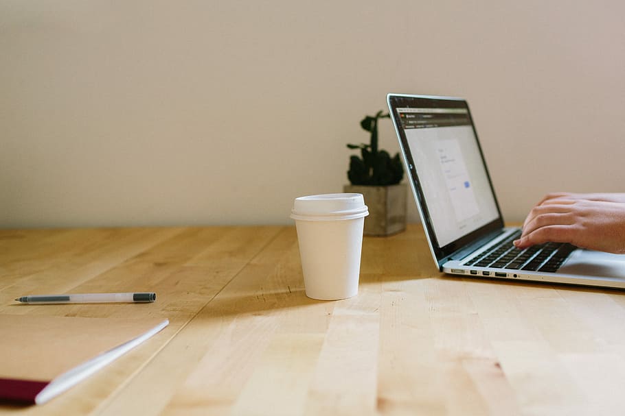 Coffee + Laptop, person using laptop beside cup, office, desk HD wallpaper