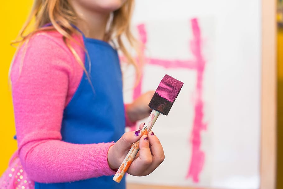 girl using pink paint brush, girl painting of white canvas, child HD wallpaper