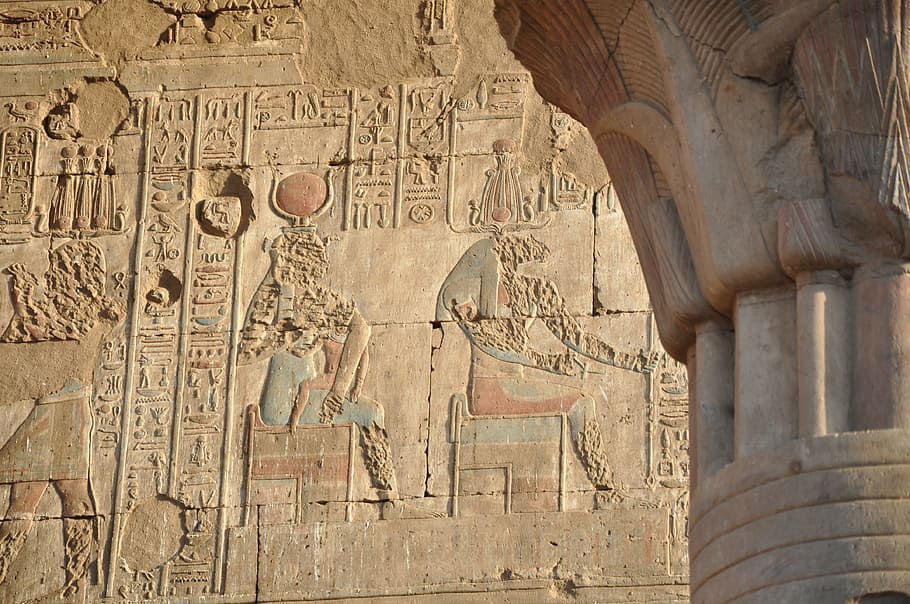 godess Isis embossed on concrete wall, egypt, temple, hieroglyphs