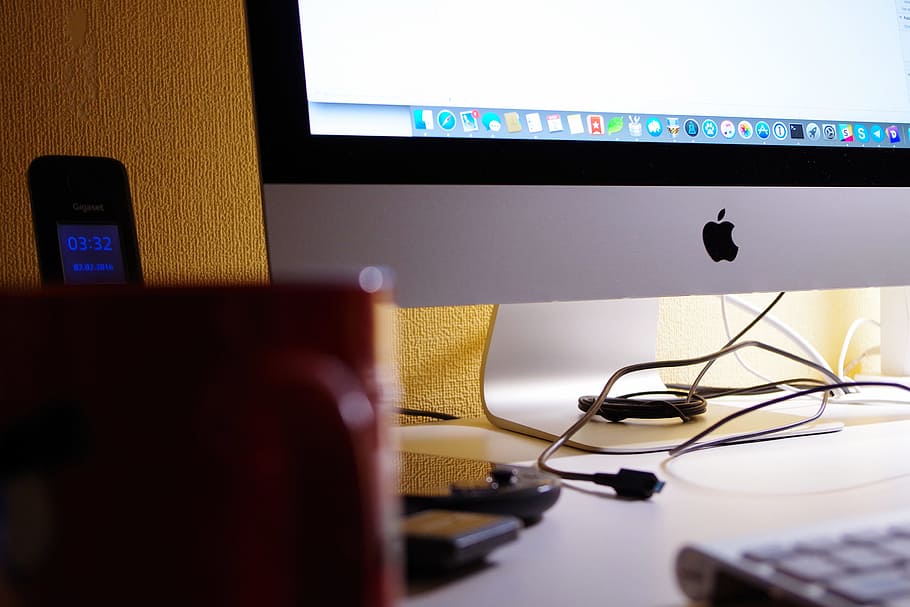 Silver Imac Turned on Beside Red Ceramic Cup, computer, desk HD wallpaper