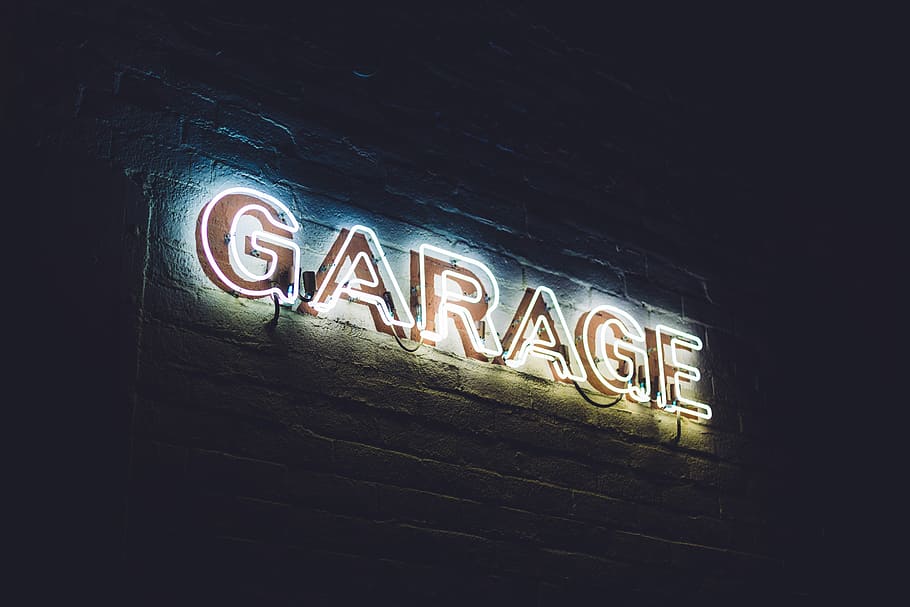 white garage neon light signage, low angle photo of red LED garage sale signage