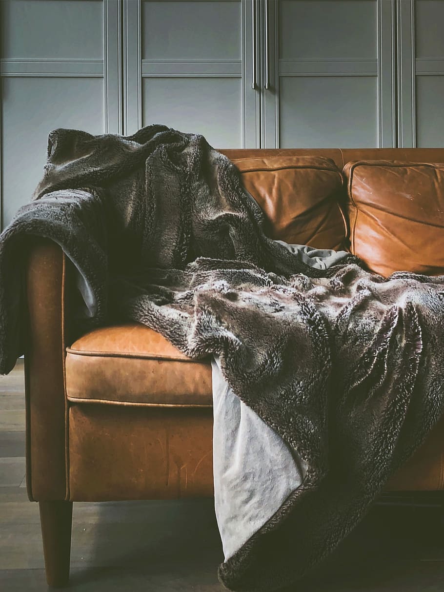 brown leather sofa, black satin textile on brown leather sofa HD wallpaper