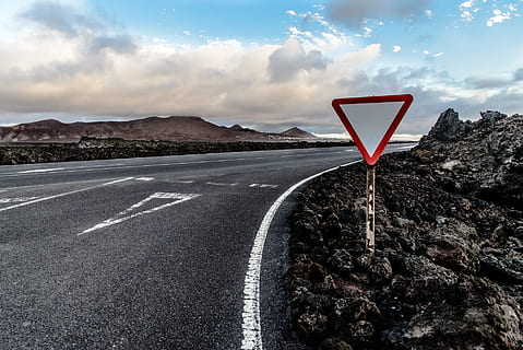 red and white road signage near road, yield, junction, confluence HD wallpaper