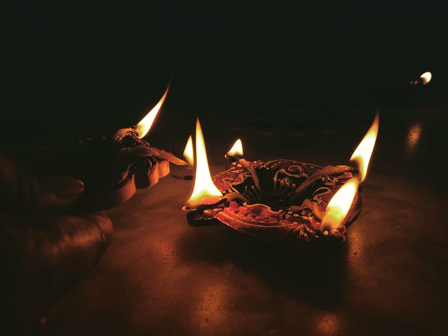 person lighting candles, fire, flame, dark, night, ashtray HD wallpaper