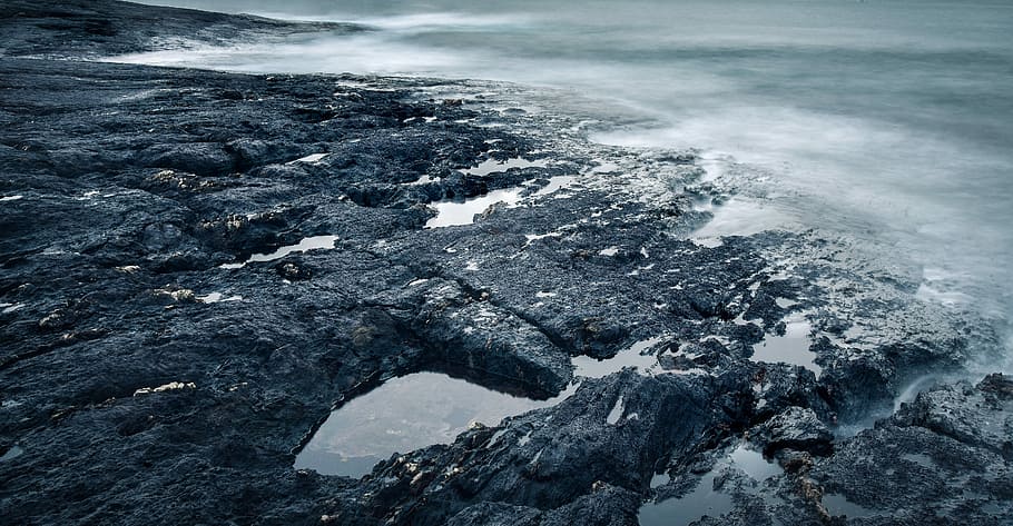 time lapse photography of seashore, photo of rocks near body of water HD wallpaper