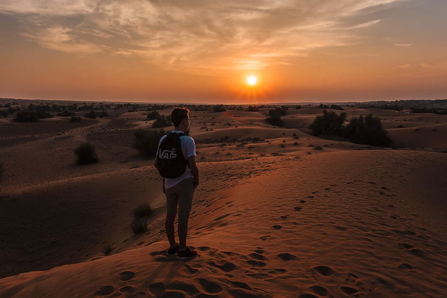 golden hour photography of man standing on top of a hill, man standing on desert HD wallpaper