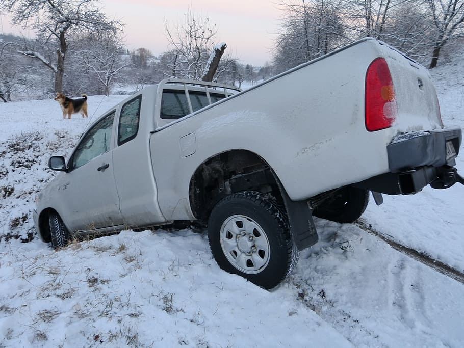 white pickup truck parked on snow covered ground during daytime HD wallpaper