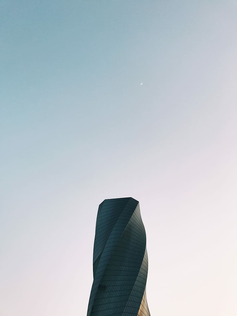 worm's eye view photography of gray tower under clear sky, gray spiral building under blue sky during daytime HD wallpaper