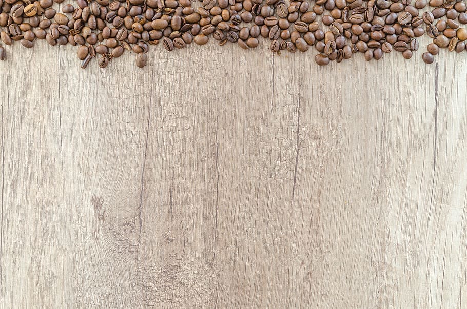 flat lay photography of coffee beans on wooden surface, caffeine