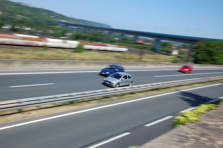 cars travelling on highway time lapse photography during daytime HD wallpaper